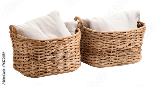 Two baskets filled with pristine white napkins side by side
