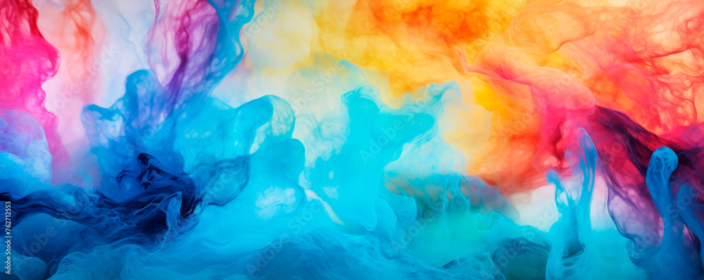 A mixture of vibrant, colorful ink is being swirled and mixed into clear water, creating mesmerizing patterns and blends of various hues. Colors diffuse and interact with the water. Banner. Copy space