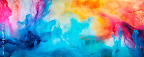 A mixture of vibrant  colorful ink is being swirled and mixed into clear water  creating mesmerizing patterns and blends of various hues. Colors diffuse and interact with the water. Banner. Copy space