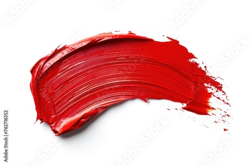 A red brush stroke on a white background. The brush stroke is thick and bold, creating a sense of movement and energy. The red color is vibrant
