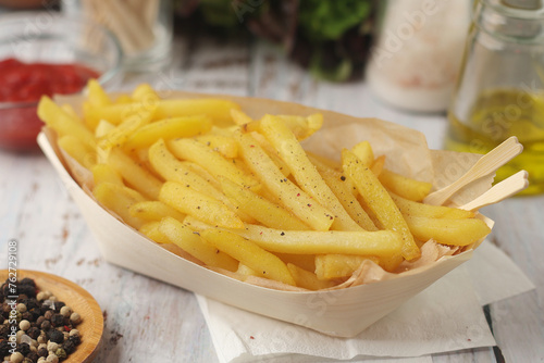 A plate with french fries potatoes.