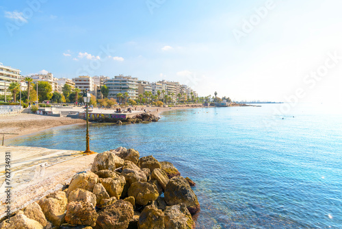 The scenic waterfront beach and promenade of Flisvos along the Athenian Riviera at the seaside town of Palaio Faliro, Greece. photo