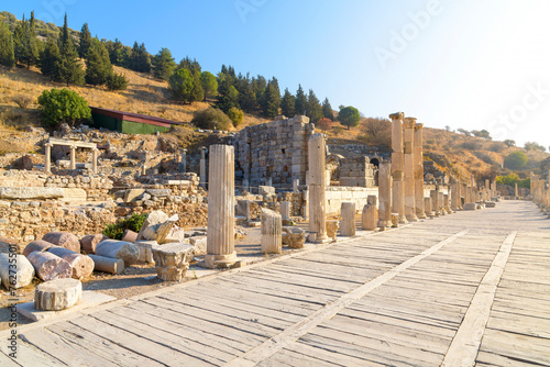 Curetes street near the Odeon and ruins of the Basilica Stoa or Great Hall at the ancient Greek city of Ephesus, in Selcuk, Turkey. photo