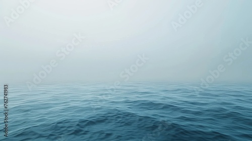 a large body of water surrounded by a foggy sky with a lone boat in the middle of the water.