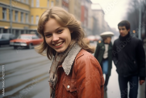 Young woman smiling on city street in 1970s © blvdone