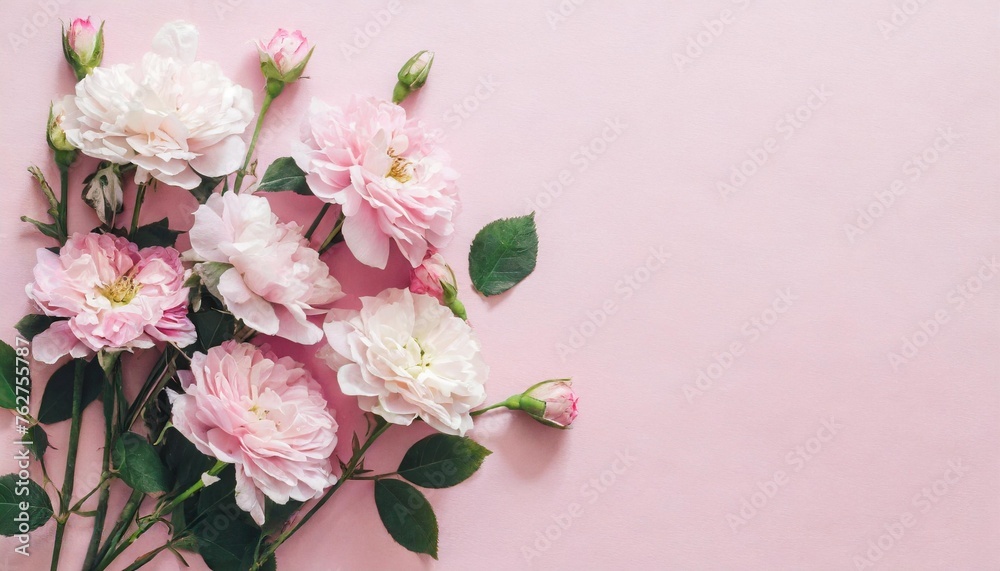 pastel pink flowers on pink background wedding concept flat lay top view