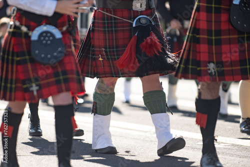 Kilts and spats are worn in honor of the Irish tradition during the St Patricks Day parade © motionshooter