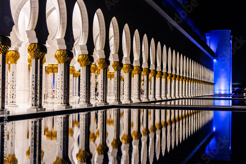 Night view of the colonnade of Sheikh Zayed Grand Mosque in Abu Dhabi, United Arab Emirates.