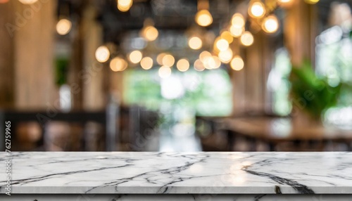 empty white marble stone table top on blurred with bokeh cafe and restaurent interior background can be used for display or montage your products