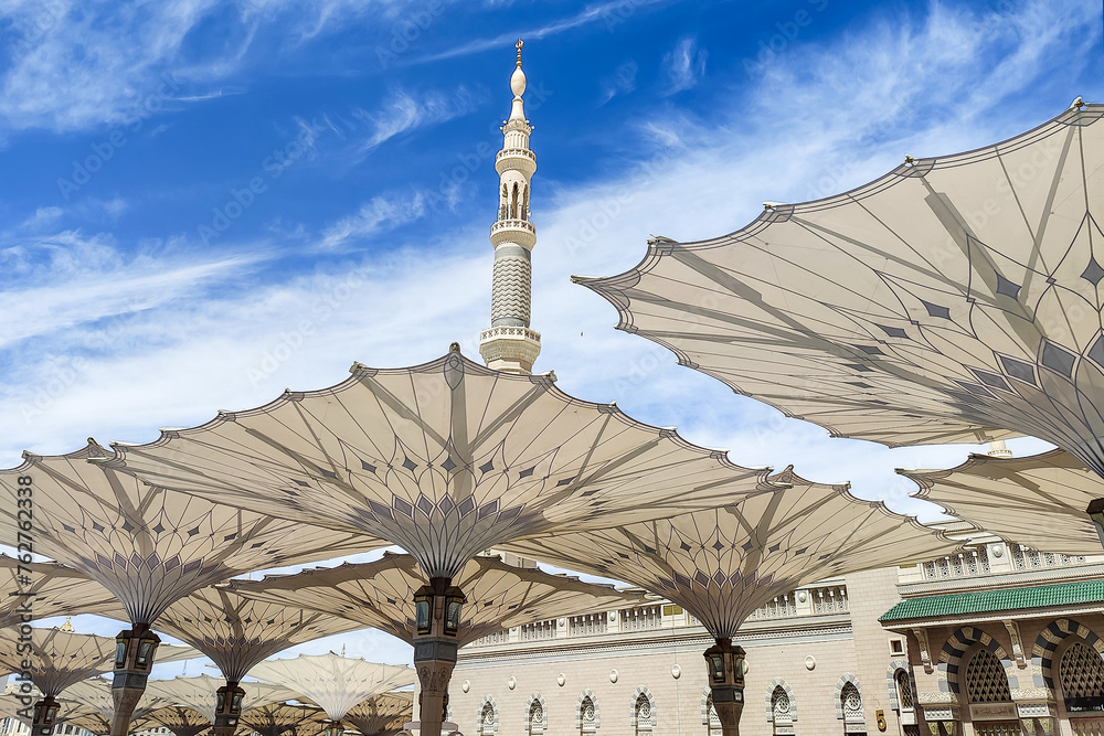 Courtyard of the Al Haram or Al-Masjid an-Nabawi mosque in Medina Saudi Arabia on a sunny day. It was the second mosque built by Muhammad in Medina and is now one of the largest mosques in the world.