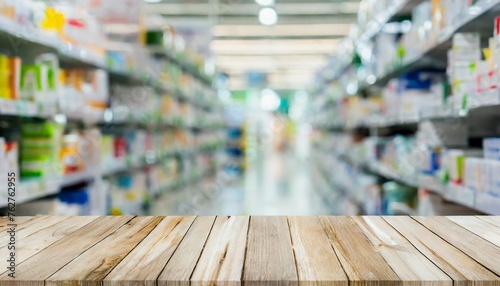 abstract blurred drug store aisle shelf distribution background with white wood perspective counter to show promote ans advertise products on display for medical pharmaceutical business concept photo