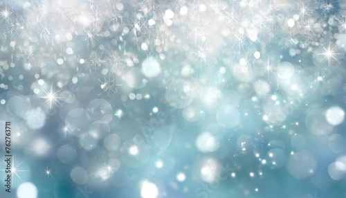 artistic winter snowfall bokeh background with sparkle silver and soft blue colored blurry christmas and new year greeting card illustration background with sparkle
