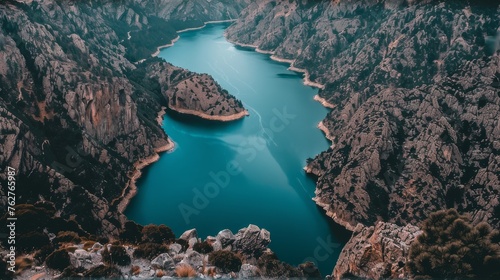 a large body of water surrounded by mountains and a lake in the middle of the middle of the picture is a large body of water surrounded by smaller mountains and a smaller body of water in the middle.