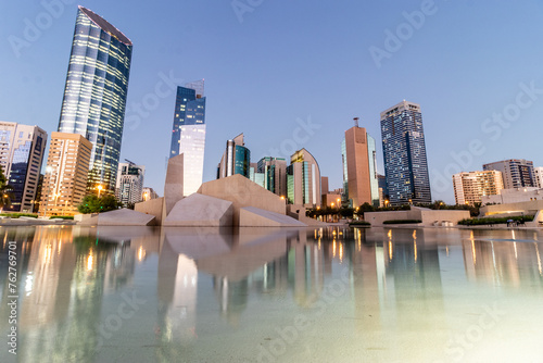 Evening view of skyscrapers and Musalla Al Hosn mosque in Abu Dhabi downtown, United Arab Emirates. photo