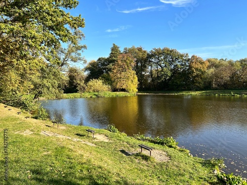 benches on the bank of a small pond