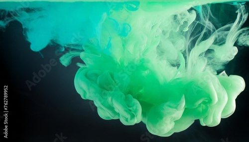 abstract blue and green paint splash isolated light green paint dissolves in water on a background like a cloud or smoke background #762789952