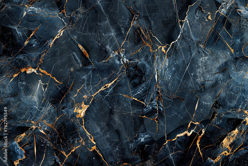 close up horizontal image of a dark marble background with golden veins pattern