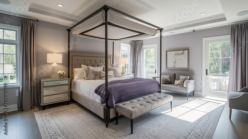 Bedroom with a serene palette of soft lavender and gray, a canopy bed, and recessed ceiling lights