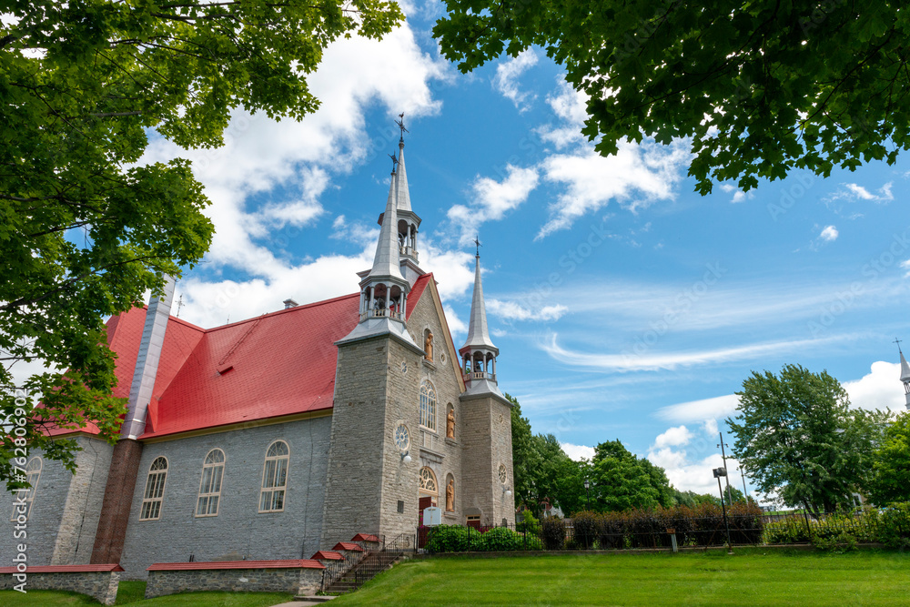 A catholic church on a blue sky