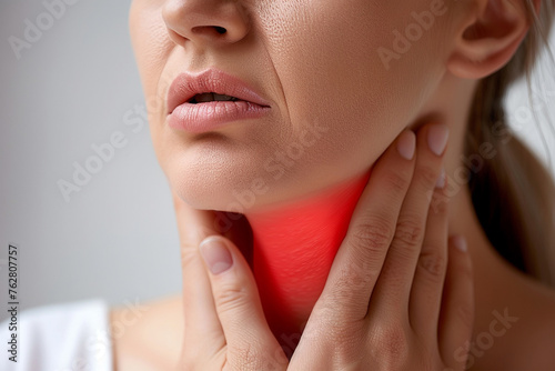 Close-up of a woman's throat pain, highlighted in red.