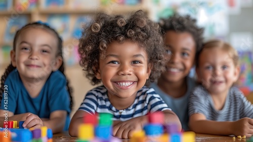 smiling african american boy looking at camera in classroom