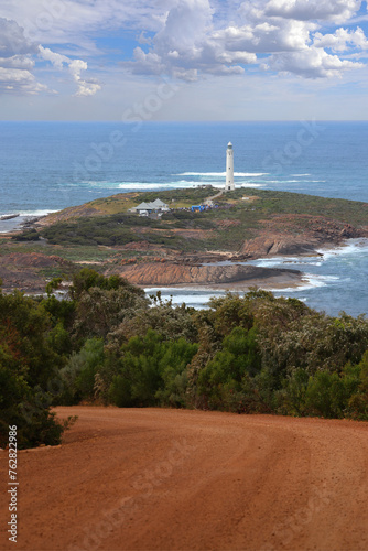 Cape Leeuwin Lighthouse, the tallest lighthouse on mainland Australia, situated at the most south-westerly point of Australia, at the tip of a peninsula where the Southern and Indian Ocean meet. photo