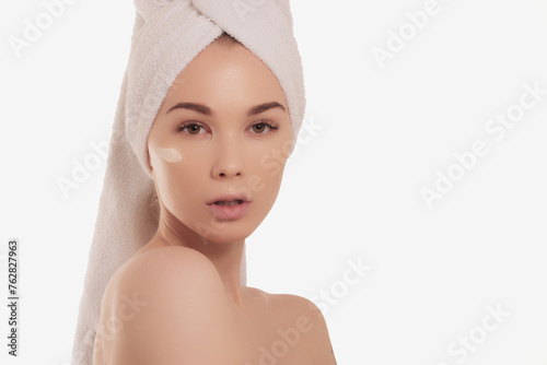 Calm serene young woman in spa bathrobe and towel relaxing after taking shower bath at home. Beauty treatment concept. Body skin and hair care