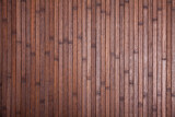 Natural dark brown wooden planks background with copyspace..