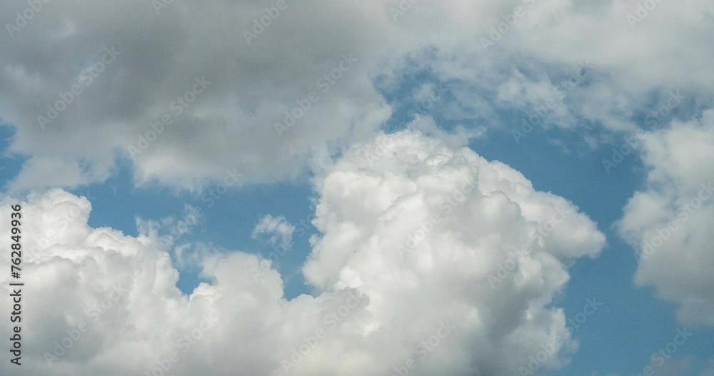 Timelapse Blue sky fluffy white clouds on summer season bright clear skyline with beautiful cloudscape. Timelapse Panorama blue sky clouds heaven on daylight with copy space. Cloudscape sunny day. Timelapse Blue sky fluffy white clouds on summer season bright clear skyline with beautiful cloudscape. Timelapse Panorama blue sky clouds heaven on daylight with copy space. Cloudscape sunny day.