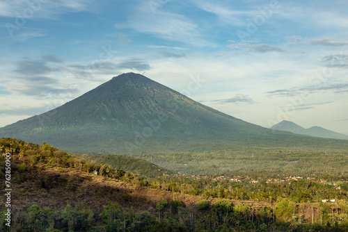 Scenic view of mount Agung volcano and Purwakerti village in touristic area of Amed in Bali during early morning sunlight photo