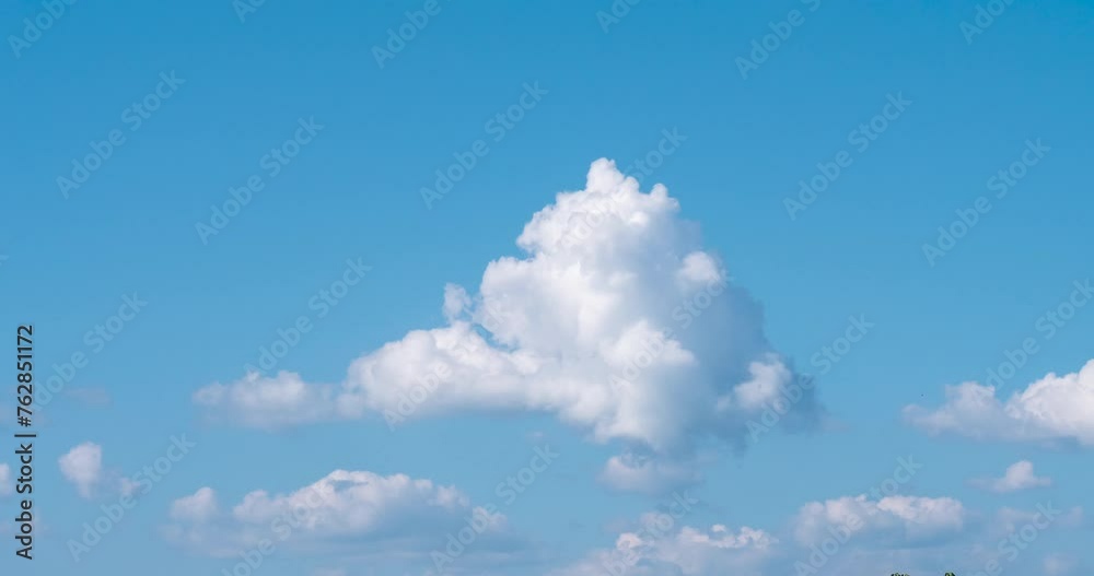 Timelapse Blue sky fluffy white clouds on summer season bright clear skyline with beautiful cloudscape. Timelapse Panorama blue sky clouds heaven on daylight with copy space. Cloudscape sunny day. Timelapse Blue sky fluffy white clouds on summer season bright clear skyline with beautiful cloudscape. Timelapse Panorama blue sky clouds heaven on daylight with copy space. Cloudscape sunny day.