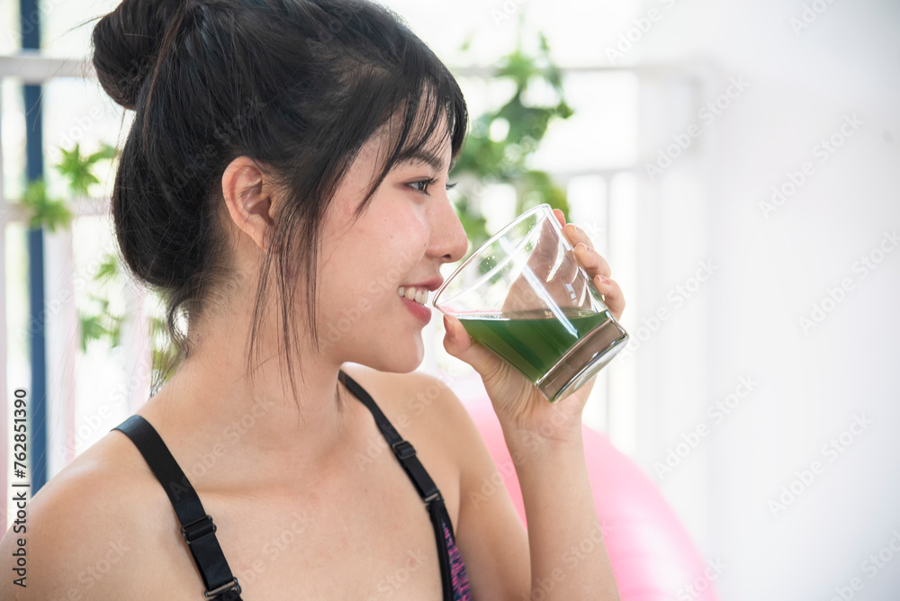 Women hands holding smoothie detox green juice fresh fruit cool drinking. Asian women smile laugh drinking vegan vegetable cool wellness beverage. Female pouring celery juice drink cocktail glass Women hands holding smoothie detox green juice fresh fruit cool drinking. Asian women smile laugh drinking vegan vegetable cool wellness beverage. Female pouring celery juice drink cocktail glass