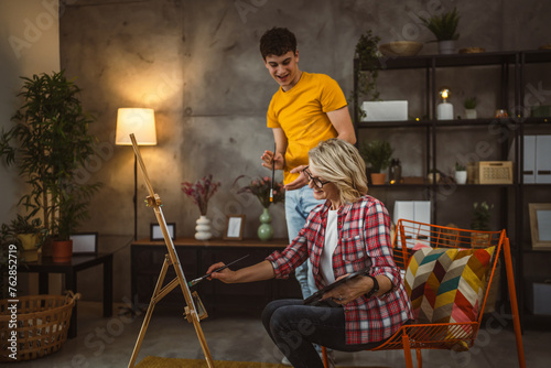 mother and son paint at home mentor artist help teach to create art