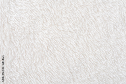 white plush fabric texture background, background pattern of soft warm material © zhikun sun
