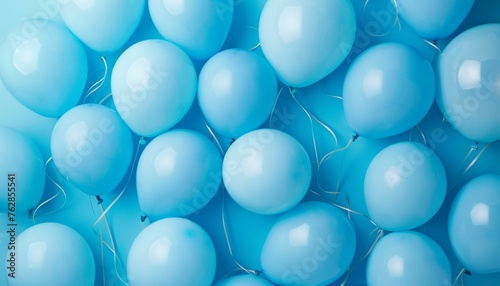 Cluster of light blue balloons filling the frame with a glossy finish and subtle reflections