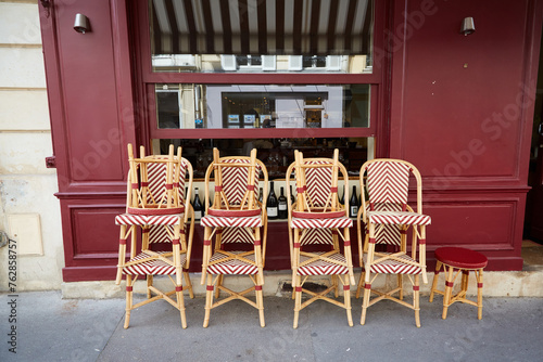 Rattan Chairs Stacked in Front of a Restaurant