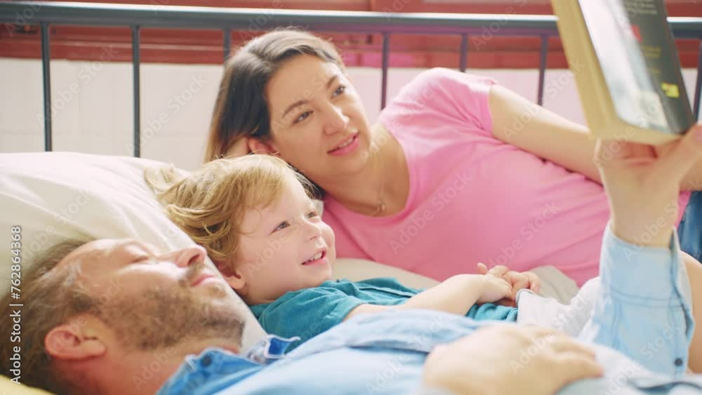Caucasian parents spend leisure time with baby boy in bedroom at house. Caucasian parents spend leisure time with baby boy in bedroom at house.