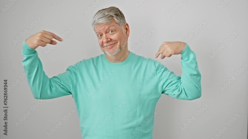 Confident grey-haired middle age man in casual clothes, proudly pointing at self with a happy smile, isolated on a white background. Confident grey-haired middle age man in casual clothes, proudly pointing at self with a happy smile, isolated on a white background.
