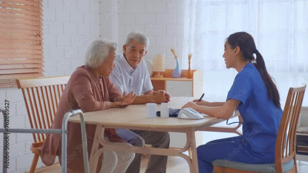 Asian caregiver nurse examine senior couple patient at home together. Asian caregiver nurse examine senior couple patient at home together.