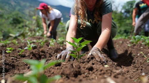 Volunteers planting trees in a deforested area, showing the link between environmental health and human health