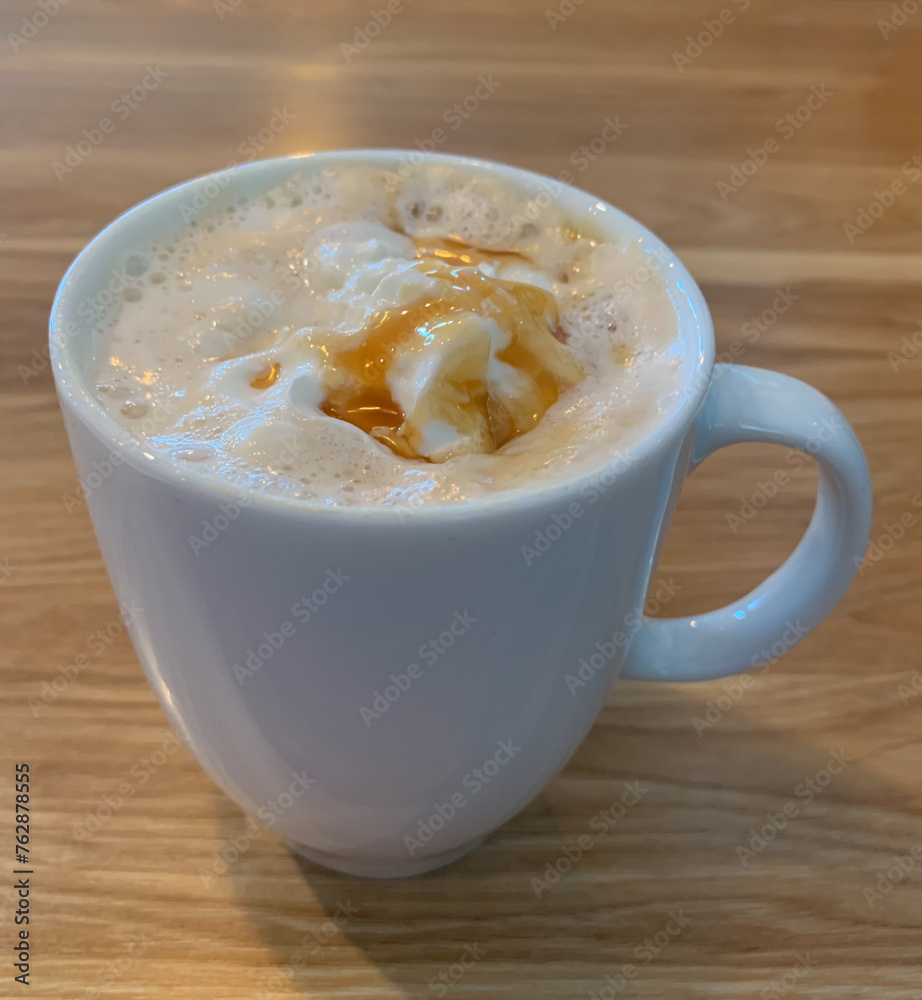 A delicious coffee cocktail drizzled with caramel. Caramel latte. A delicious coffee cocktail drizzled with caramel. Caramel latte.