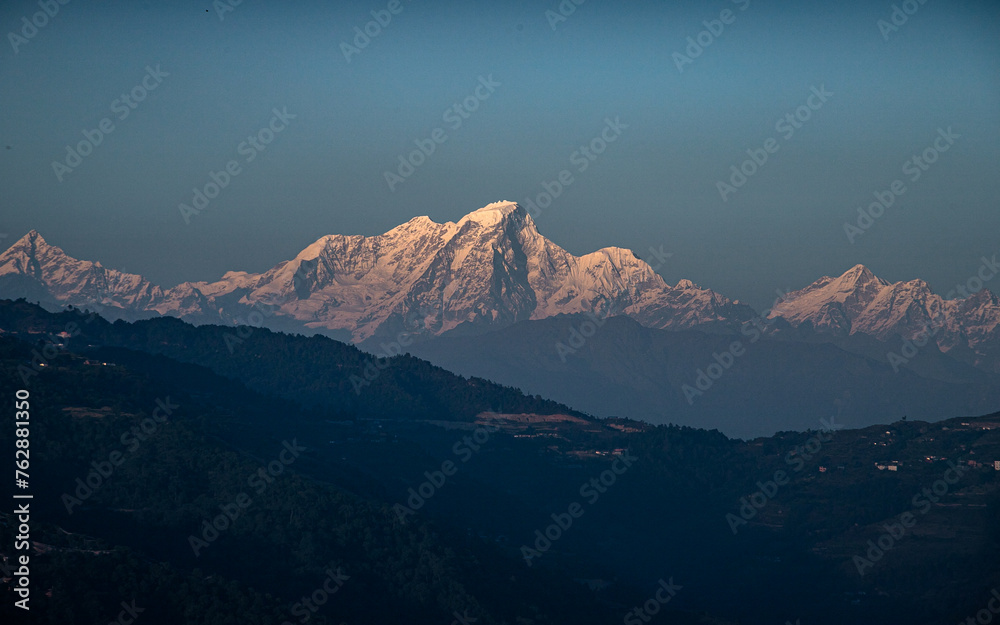 sunset over the snow covered mountain in Nepal. sunset over the snow covered mountain in Nepal.