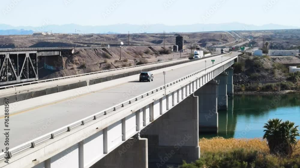 Trucks and Cars Driving Over a Bridge, Colorado River , I-40 freeway East Trucks and Cars Driving Over a Bridge, Colorado River , I-40 freeway East