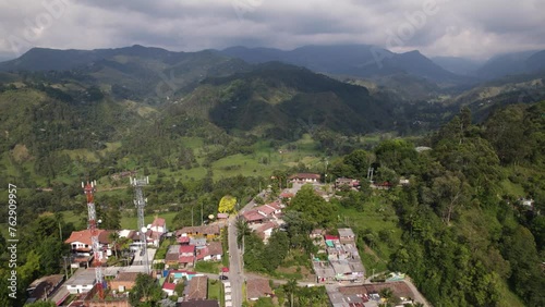 Drone flyover Salento toward Lush forested valley on Colombian Mountains, Colombia photo