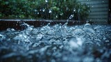 Pattering rainwater flows from a gutter, a scene of urban rainfall