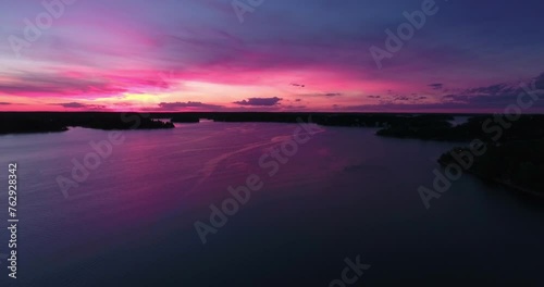 Aerial: Night Descends On Vaxholm Fortress, Surrounded By The Calm Waters Of Stockholm'S Archipelago, With The Fortress Lights Creating A Serene Ambiance photo