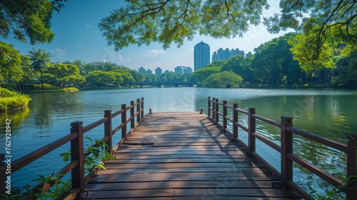 Serene waterside view from a pier overlooking a lush urban park photo