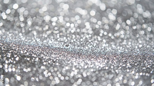 Silver glitter abstract background. Defocused bokeh lights.