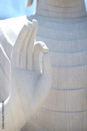 Close-up of white stone Buddha's hand