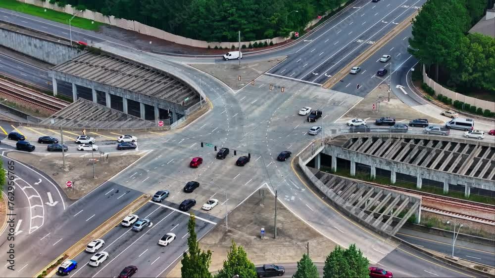 Aerial top down of busy multi lane junction and tracks underpass in American Town. Aerial top down of busy multi lane junction and tracks underpass in American Town.